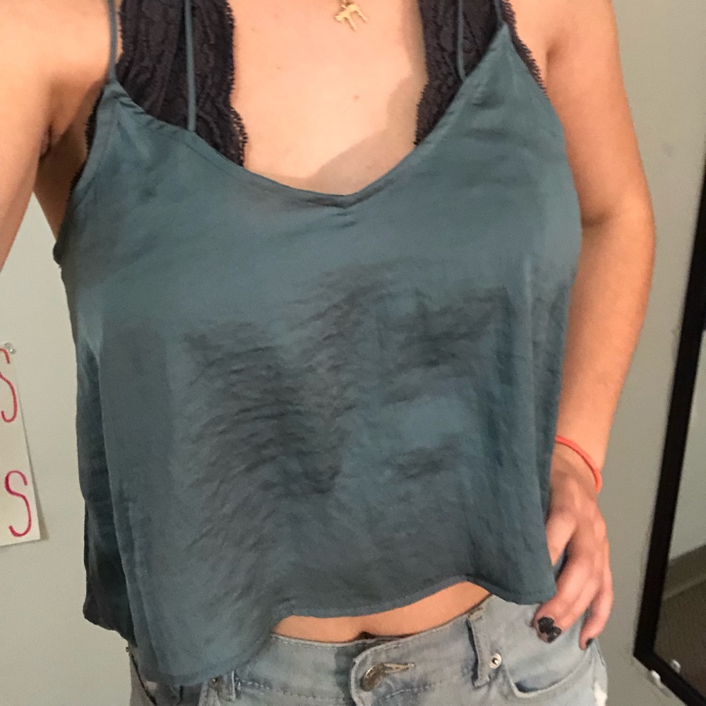 Shiny, slinky green crop top with crossed back